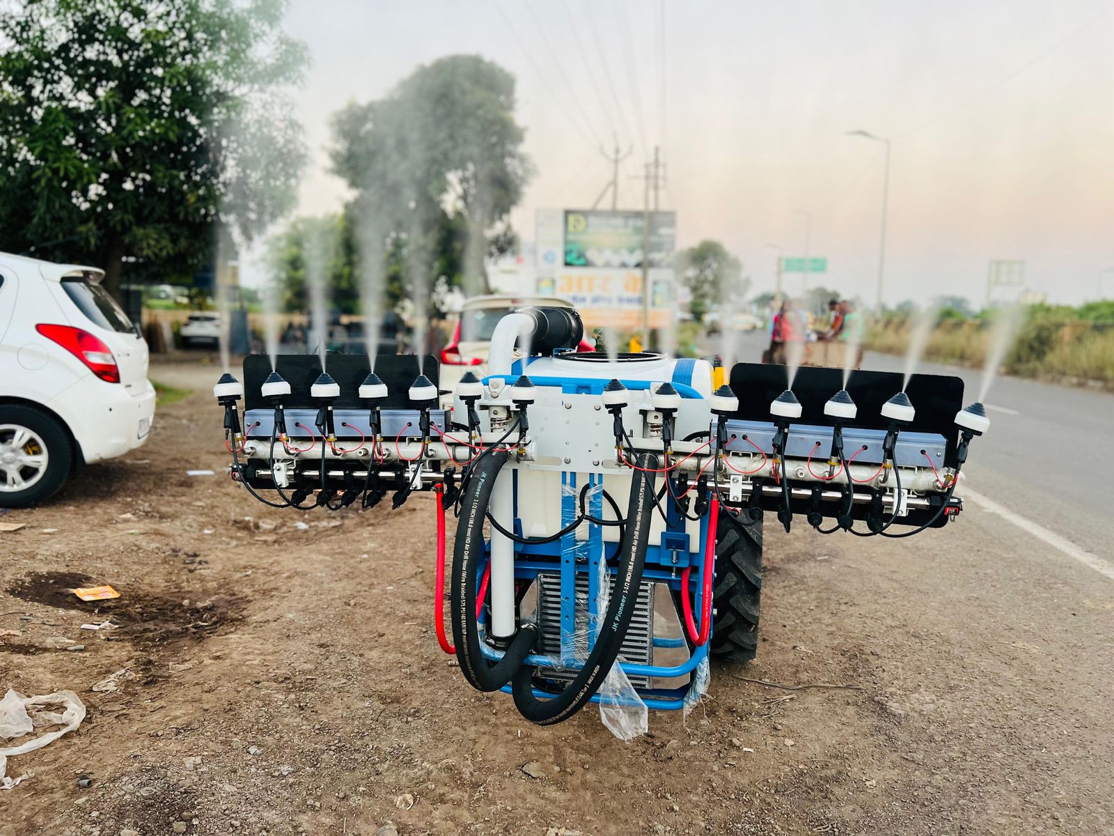 Front view of sprayer with 14 nozzles running